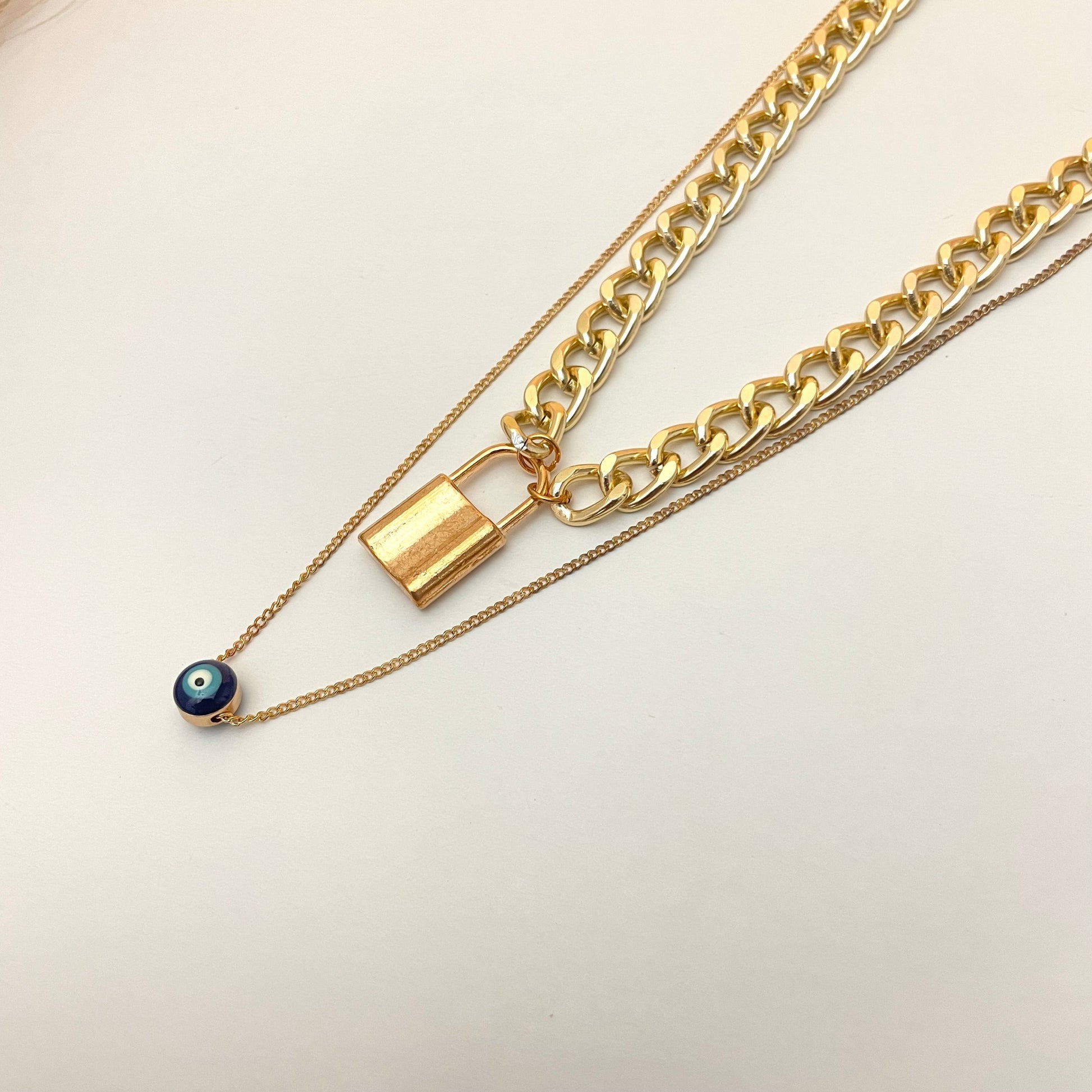 Golden Double Layered Chain Necklace With Evil Eye With Lock Charm - DropShp