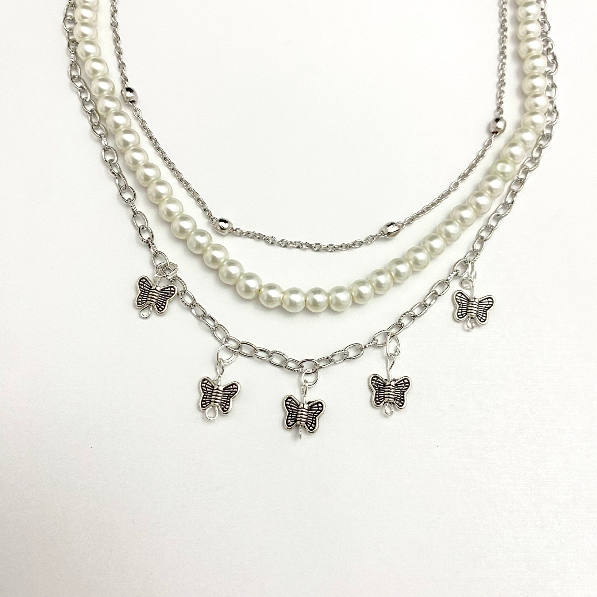 Triple Layered Pearl Chain Necklace With Hanging Butterfly Charms - DropShp